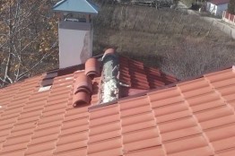 Broken roof tiles replacement and chimney repair of a house in Kranevo