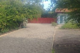Building a river stone driveway and fence of a property near Krapets